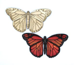 layered wood paint kit butterfly disassembled in pieces for you to see each layer. Monarch Butterfly paint kit with layered wood canvas. Butterfly wings in 3d with a 3d butterfly body. paint kit comes with acrylic paint, red, orange and five other paint colors for you to complete your 3d butterfly and hang it on the wall, give it as a gift idea for her, or many other ways to enjoy butterflies and painting. Paint with a friend or give it as a gift idea for kid.